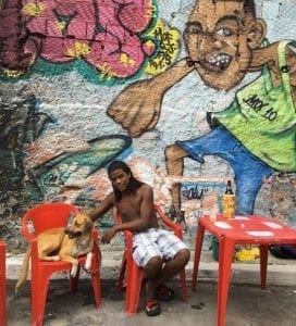 Sergio-and-Thor-at-MOF-Meeting-of-Favela-in-Rio-with-mural-from-last-year-by-Talu